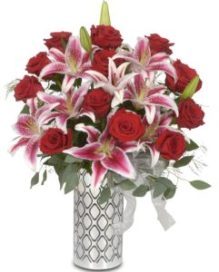 Red roses and Starfighter Lilies are known for their dark pink centers and crisp white edges. Lilies are a fragrant display and people love the flowery aroma they produce. These flowers are finished flawlessly with eucalyptus and fern. 