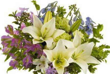 Soft shades of lilies, lofty delphinium and blossoms mingle together to create this casual bouquet, just right for any occasion.