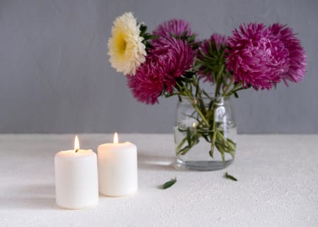 Romantic flowers decor And Candles on white table
